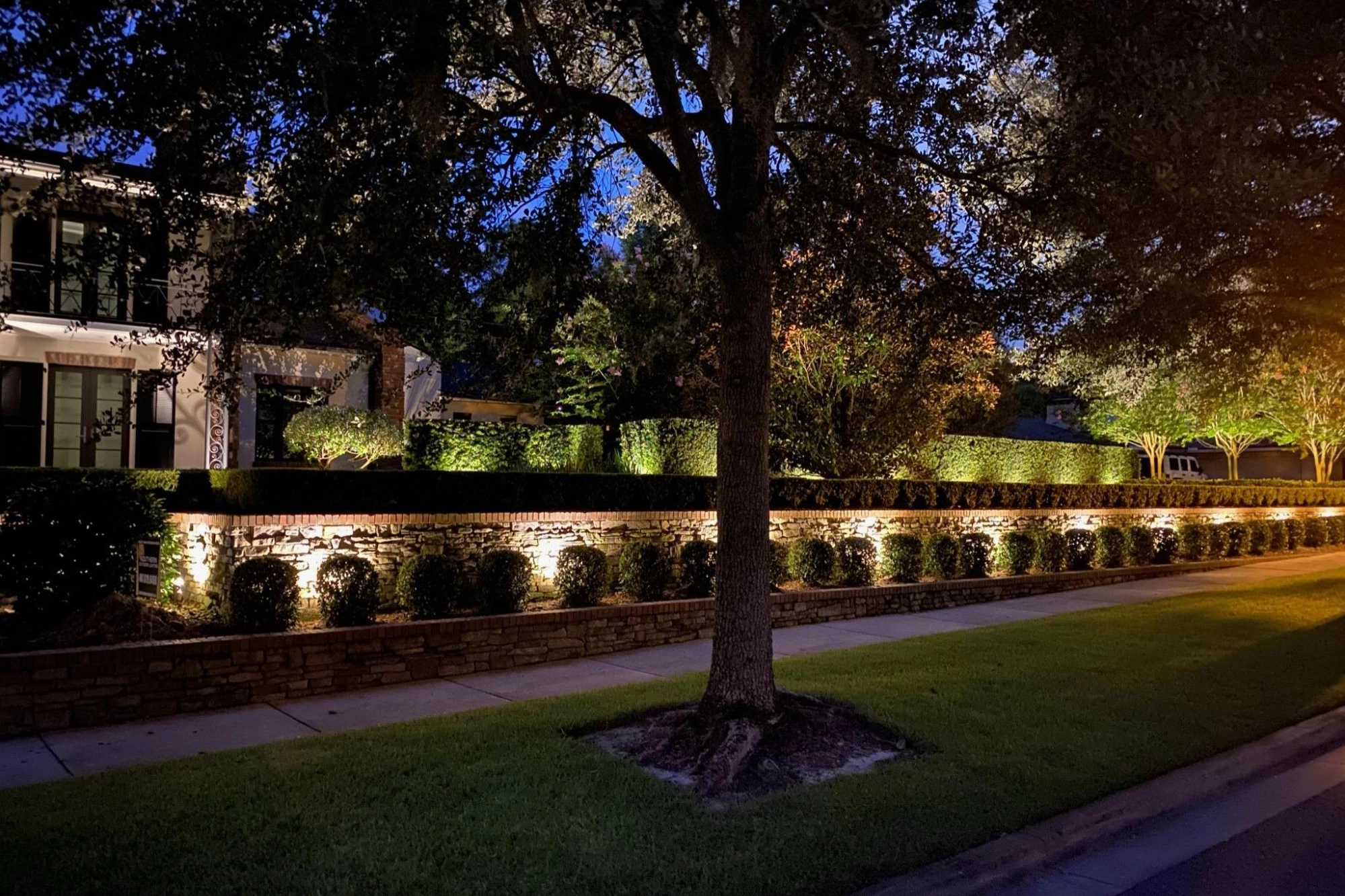 Installation by Southern Outdoor Lighting in Winter Park is showing a silhouetting technique