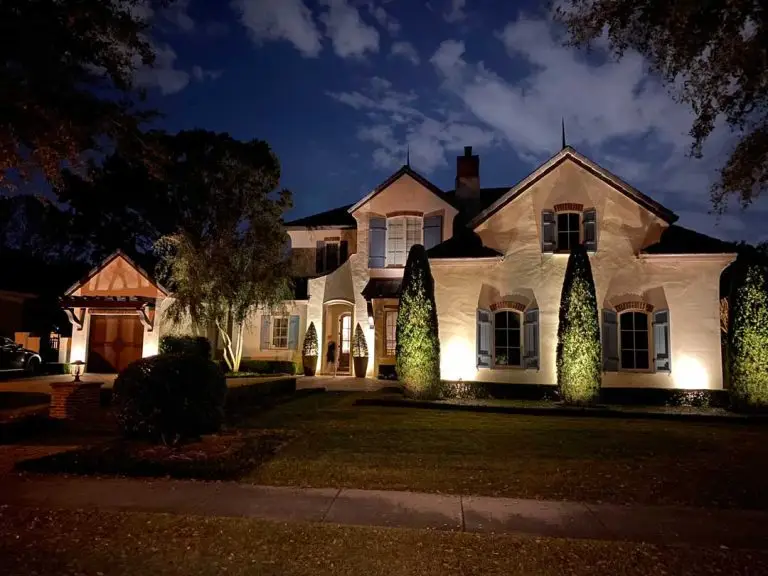 Winterpark House at night with landscape lighting