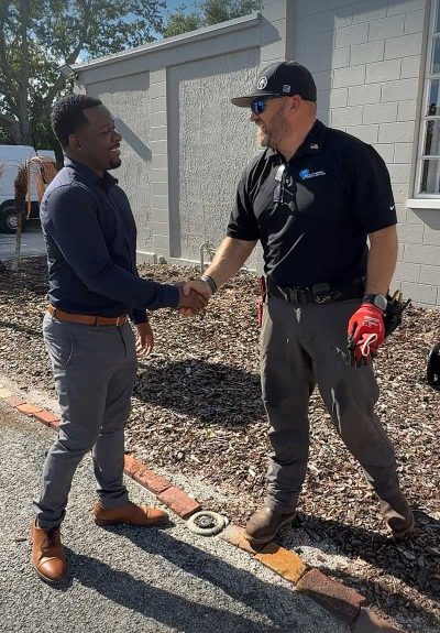 Owner, Jaison Heard, and a customer shaking hands