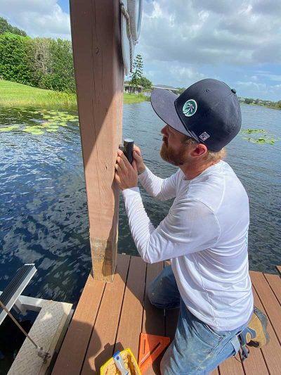 Jacksonville owner, Nick Tralka, working on a dock lighting install and repair.